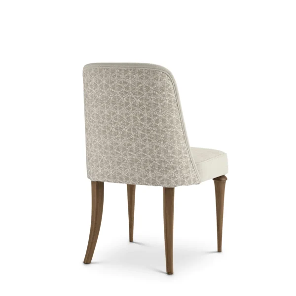 Elegant luxury Italian dining chair with patterned backrest, wooden legs, and premium upholstery.