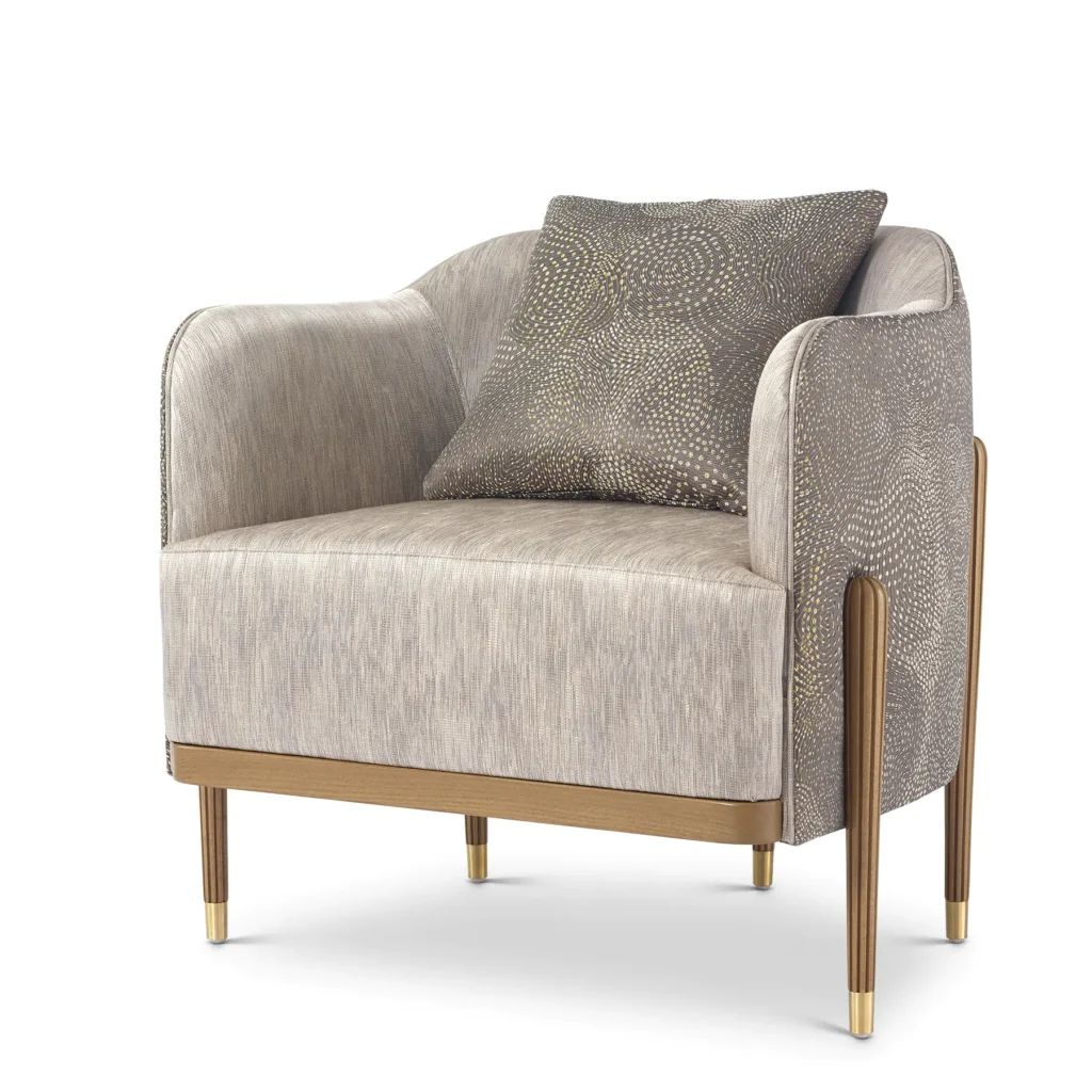 Italian luxury design armchair with patterned cushion and elegant gold accents, high-end furniture.