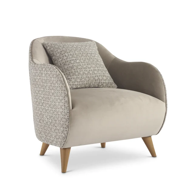 Elegant Italian luxury armchair in beige fabric with wooden legs and patterned cushion. High-end design furniture.