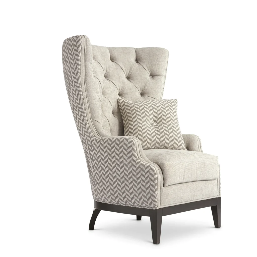 Italian luxury high-back armchair with tufted design and patterned upholstery, crafted for elegance and comfort.