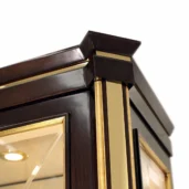 Luxury Italian furniture detail with dark wood and gold accents, highlighting elegance and craftsmanship.