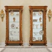 Luxurious handcrafted wooden display cabinets for villas, ornate design, showcasing decorative dishware. Italian craftsmanship.