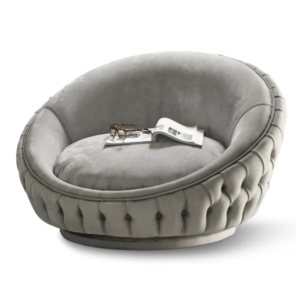 Luxurious Italian round gray chair with tufted design, reflecting high-end style and craftsmanship.
