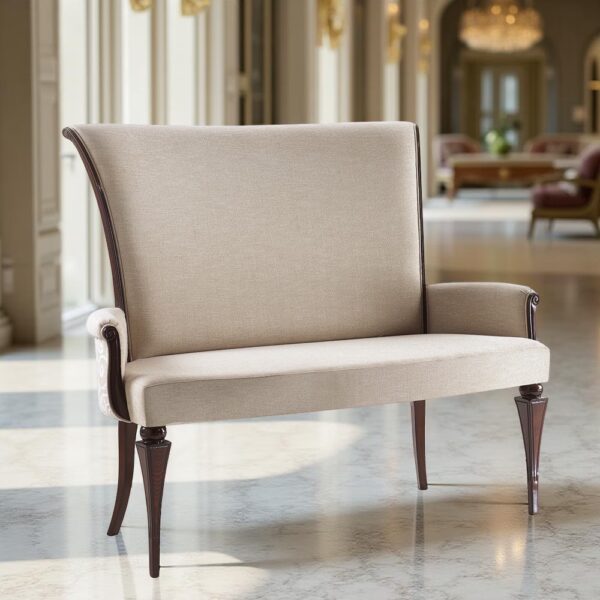 An upholstered beige loveseat with dark wooden legs and armrests, set in an elegant space with marble flooring, large windows, and chandeliers.