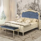 Luxury Italian bedroom with elegant tufted headboard and matching bench. High-end design furniture in classic style.