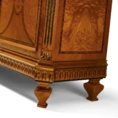 Handcrafted wooden furniture detail with intricate carvings from an Italian artisan factory. Ideal for luxury interiors.