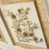 Handcrafted Italian wooden panel with elegant gold floral design for luxury interiors.