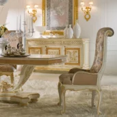 Elegant handcrafted Italian furniture set in luxurious villa interior with detailed woodwork and ornate designs.