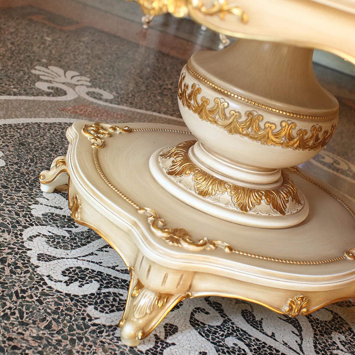 Luxurious Italian table base with intricate gold detailing, showcasing high-end craftsmanship and elegant design.