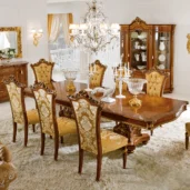 Luxury Italian dining room with ornate wood furniture, elegant chairs, and a sparkling chandelier for high-end decor.