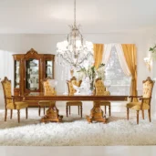 Luxurious Italian dining room with ornate wooden furniture and elegant chandelier, exuding classic sophistication.