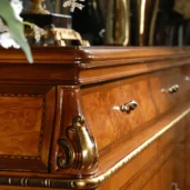 High-end luxury Italian wooden cabinet with gold accents and intricate detailing, handcrafted by artisans.