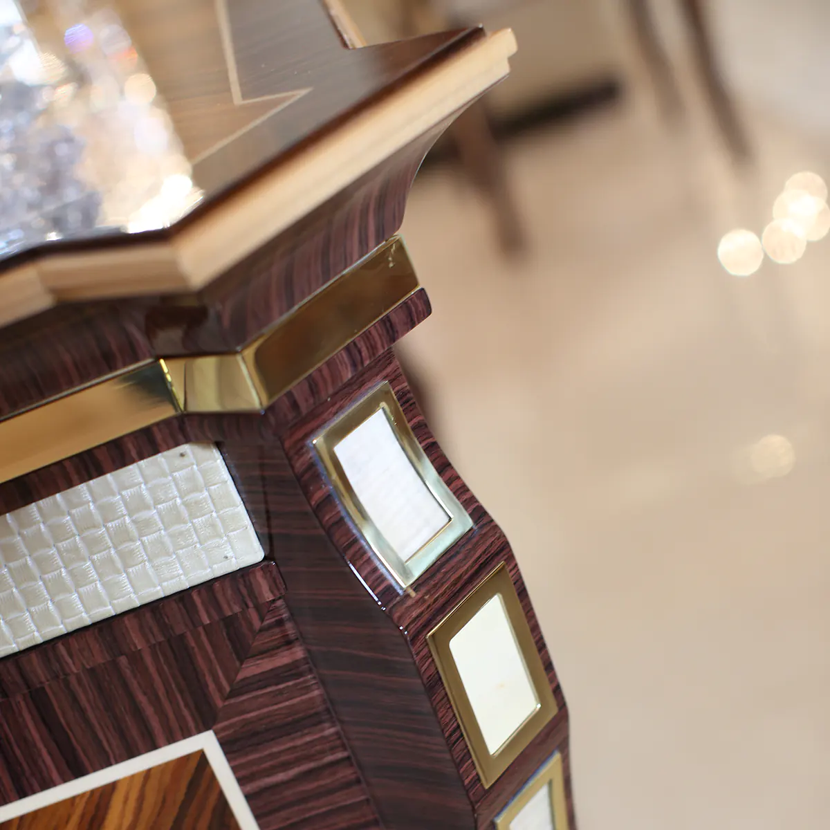 Elegant wood furniture detail with gold accents, crafted by an Italian factory for luxury villa interiors.