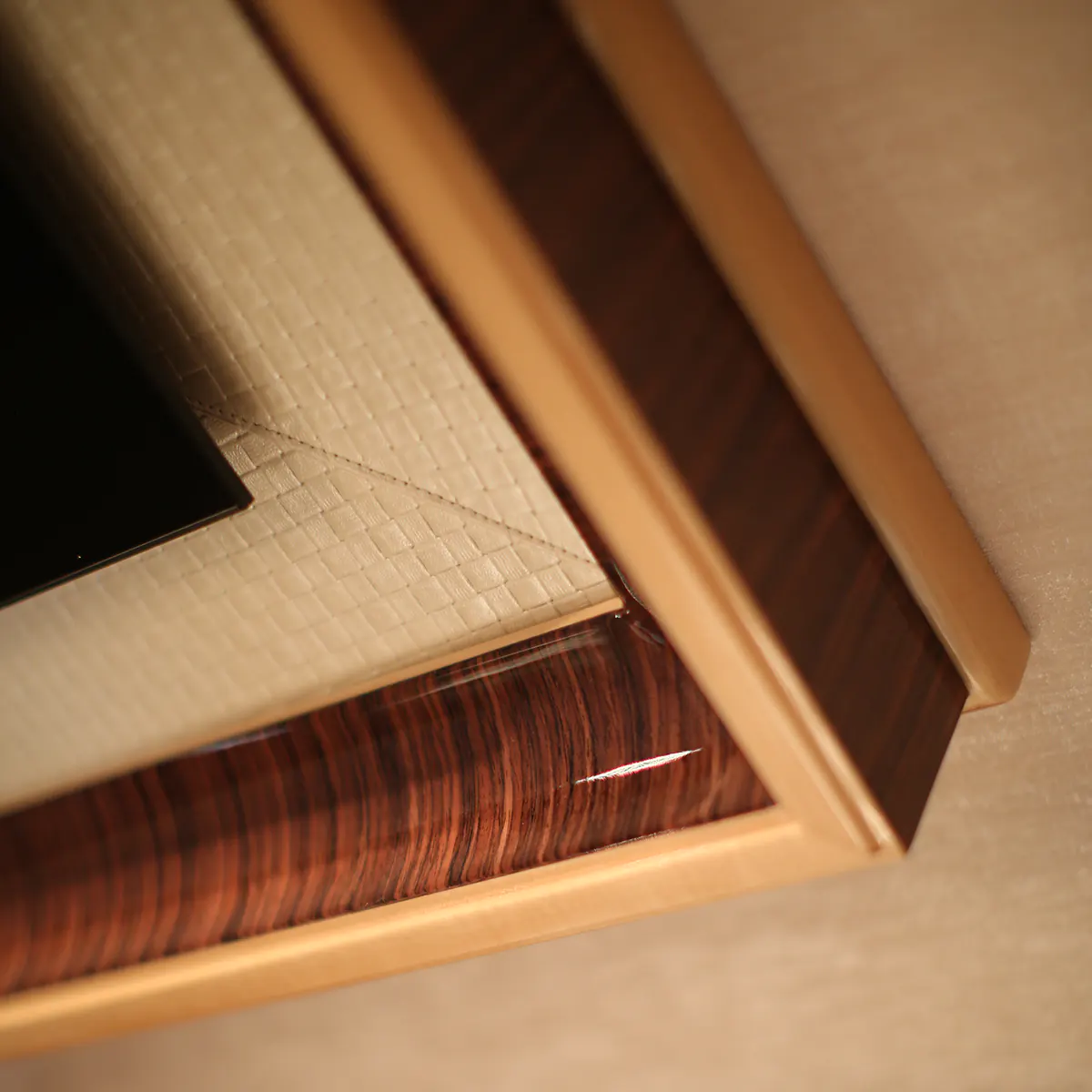 Luxurious handcrafted wooden furniture detail from Italian villa interior design.