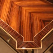 Luxury handcrafted wooden furniture detail, showcasing exquisite craftsmanship by an Italian factory for interiors.