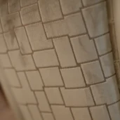 Elegant fabric texture in beige tones with geometric pattern for luxury handmade Italian furniture design.
