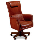 Brown leather executive chair with a high back and a headrest, mounted on a swivel base with brass casters.