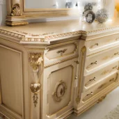 Elegant Italian luxury furniture with intricate gold detailing and classic design elements.