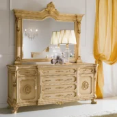 Luxurious Italian-designed furniture with ornate mirror and elegant detailing in a classic, opulent living room setting.