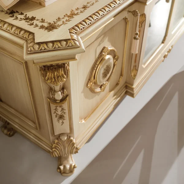 Elegant hand-carved Italian furniture with gold accents, showcasing luxury design and craftsmanship.