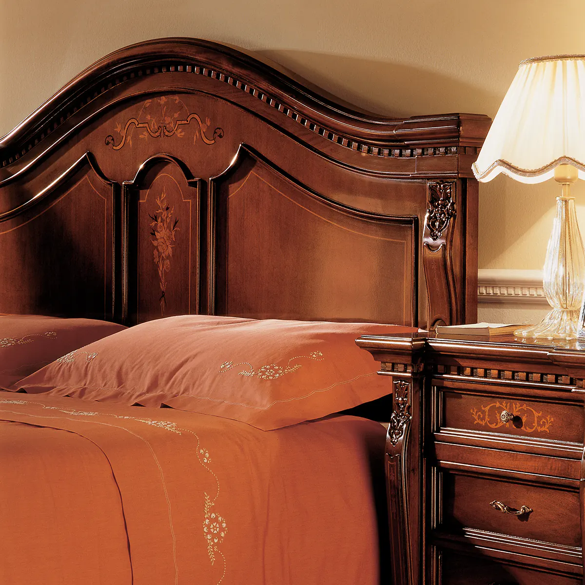 Luxurious handcrafted wooden bed and nightstand with elegant detailing, perfect for villas and palaces.