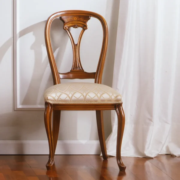 Elegant handcrafted wooden chair in a sophisticated Italian villa dining room.
