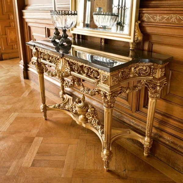 Ornate handmade wooden console table with intricate gold detailing, perfect for luxury villa interiors.