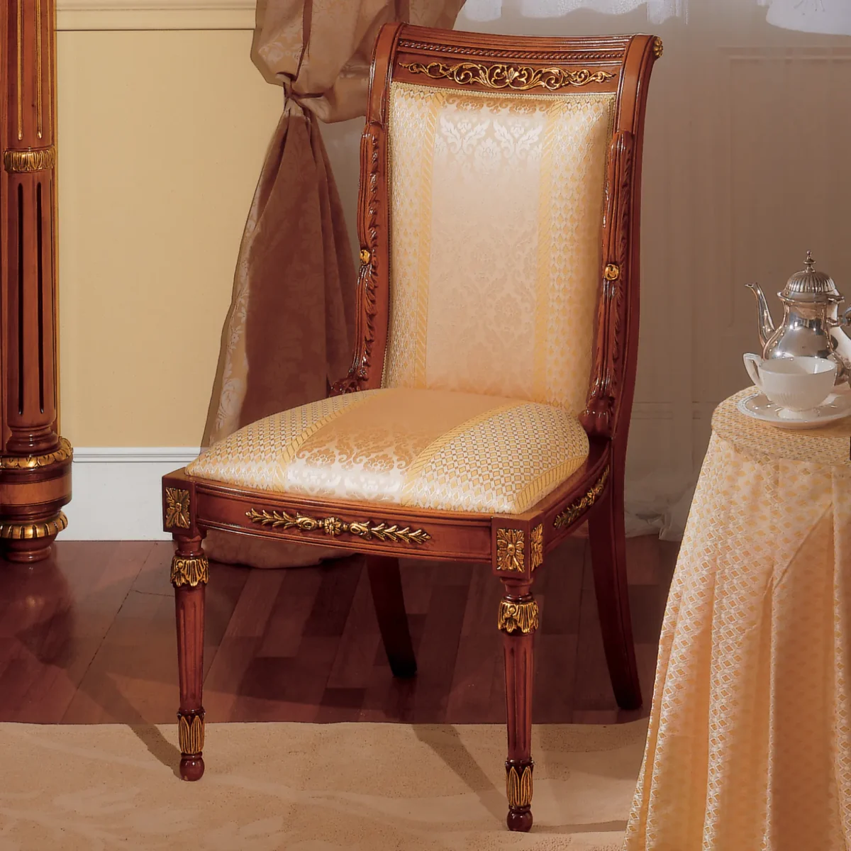 Elegant handmade wooden chair with gold details and luxurious upholstery, ideal for villas and palaces.