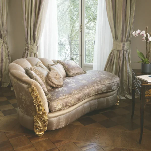 Chaise longue with embroidered velvet upholstery, refined wood carvings, and gold leaf finish