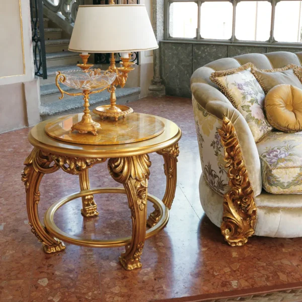 Hand-carved coffee table with intricate details and gold leaf finish