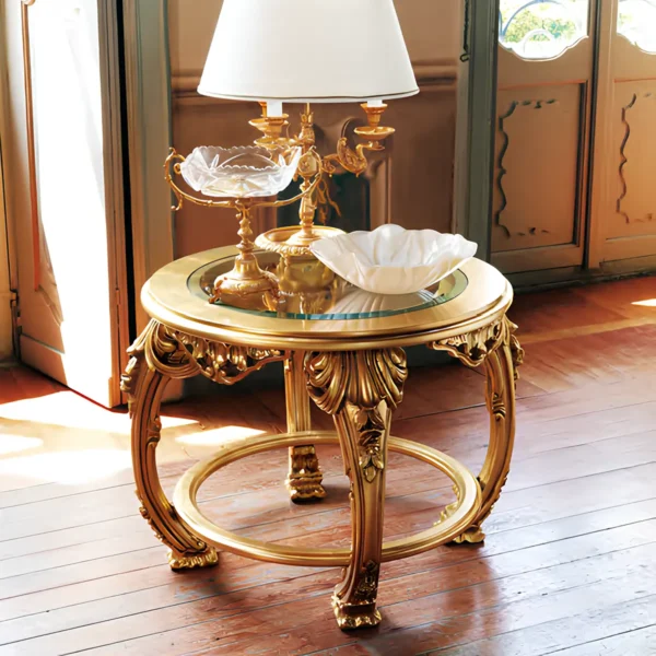 Hand-carved coffee table with intricate details and gold leaf finish