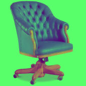 Blue leather office chair with tufted backrest, wooden accents, brass nailhead trim, and five-leg base with casters