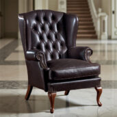 Poltrona da lettura classica in pelle nera con schienale trapuntato e borchie decorative