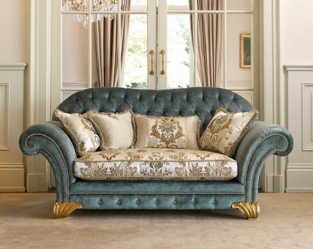 Classic luxury sofa with golden finishes and decorative cushions
