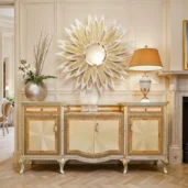 Neoclassical 4‑door sideboard with 2 drawers, cream starburst marquetry panels, contrasting veneer frames and gilded cabriole legs, serpentine front.