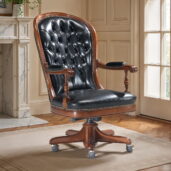 Marzorati executive office chair in black leather with a high button‑tufted back, nailhead trim, padded arm caps on turned supports and a five‑star wooden base on casters.