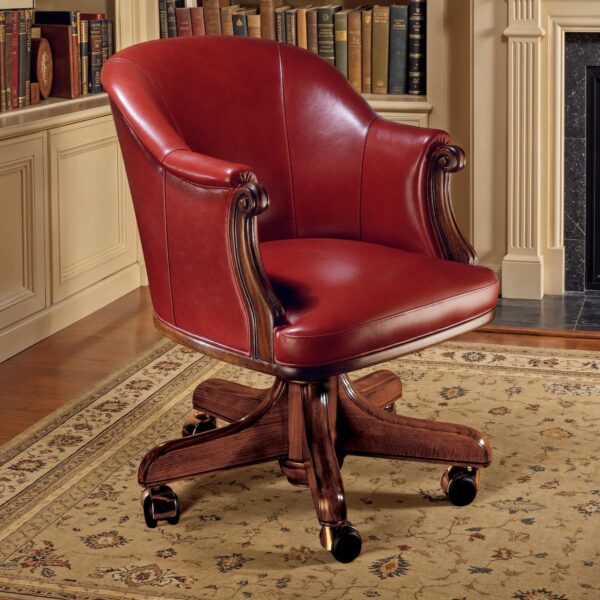 Marzorati executive office chair in red leather with an enveloping barrel‑back, carved scroll arms and a five‑star wooden base on casters.