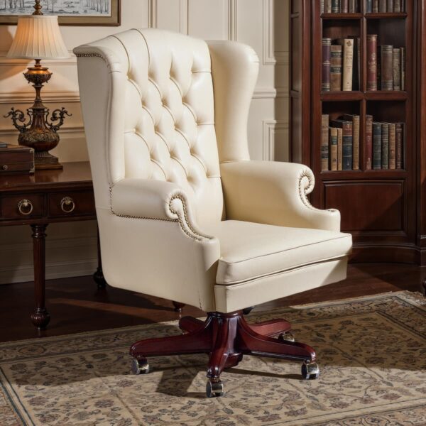 Marzorati executive chair in ivory leather, tufted wingback high back, solid wood five-star swivel base with casters.