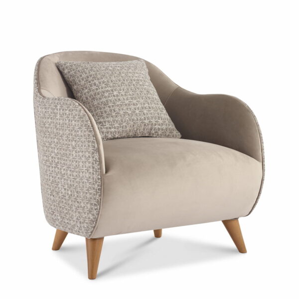Contemporary armchair upholstered in beige velvet fabric with wooden legs and matching cushion