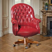 Marzorati red leather executive armchair with capitonné backrest and solid wood base, luxury Italian office furniture