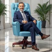 Luxurious turquoise leather executive swivel armchair with classic design, placed in a bright lounge with windows and plants, perfect for high-end home office furniture and fresh, elegant comfort.