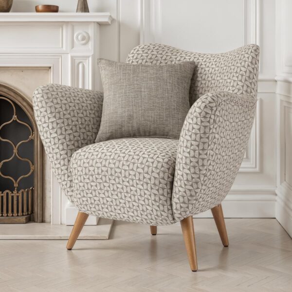 Modern compact armchair with grey geometric fabric upholstery, wooden legs and matching cushion