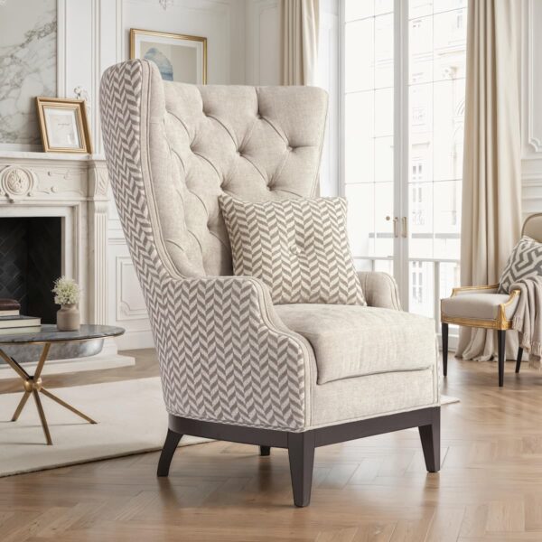 Designer armchair with tufted high backrest, beige fabric upholstery, dark wooden legs and matching cushion