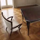 Extendable dining table handcrafted in burl veneer with glossy finish and elegant sculpted legs, ideal for luxury interiors.