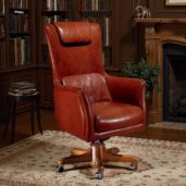 Elegant high-back executive armchair in premium brown leather with wooden swivel base, crafted by Marzorati for luxury offices.