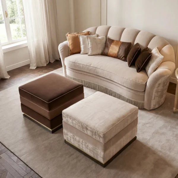 Square luxury living room pouf upholstered in fine Italian fabrics, styled with a curved sofa and tone-on-tone rug.