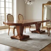 Empire style wooden dining table with matching chairs, handcrafted by Marzorati.