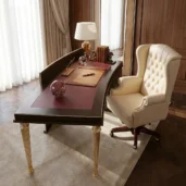 High-end executive office desk featuring a curved geometric modesty panel, gold fluted legs, and a beige tufted leather swivel chair