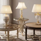 Studio shot of a gold occasional table featuring a dark bronzed mirror top and sleek curved tripod legs