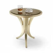 Studio shot of a gold occasional table featuring a dark bronzed mirror top and sleek curved tripod legs